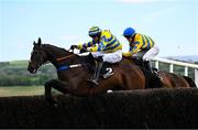 2 May 2025; Fountain House, left, with Eoin Mahon up, jumps the last on their way to winning the Stanley Asphalt Hunters Steeplechase for the Bishopscourt Cup, from eventual third place Eyes Off Annie, right, with Maxine O'Sullivan up, on day four of the Punchestown Festival at Punchestown Racecourse in Kildare. Photo by Seb Daly/Sportsfile