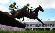 2 May 2025; Fountain House, right, with Eoin Mahon up, jumps the last on their way to winning the Stanley Asphalt Hunters Steeplechase for the Bishopscourt Cup, from eventual third place Eyes Off Annie, left, with Maxine O'Sullivan up, on day four of the Punchestown Festival at Punchestown Racecourse in Kildare. Photo by Seb Daly/Sportsfile