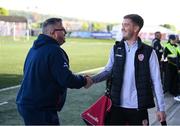 2 May 2025; Derry City goalkeeper Brian Maher with Shelbourne analyst Martin Doyle before the SSE Airtricity Men's Premier Division match between Derry City and Shelbourne at The Ryan McBride Brandywell Stadium in Derry. Photo by Stephen McCarthy/Sportsfile
