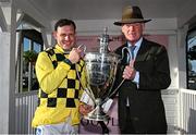 2 May 2025; Jockey Paul Townend and trainer Willie Mullins with the trophy after winning the Boodles Champion Hurdle with State Man on day four of the Punchestown Festival at Punchestown Racecourse in Kildare. Photo by Seb Daly/Sportsfile