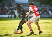 2 May 2025; Jeannot Esua of Galway United in action against Kian Leavy of St Patrick's Athletic during the SSE Airtricity Men's Premier Division match between St Patrick's Athletic and Galway United at Richmond Park in Dublin. Photo by David Fitzgerald/Sportsfile