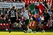 2 May 2025; Evan McLaughlin of Cork City in action against Rory Gaffney and Matt Healy of Shamrock Rovers during the SSE Airtricity Men's Premier Division match between Cork City and Shamrock Rovers at Turner's Cross in Cork. Photo by Brendan Moran/Sportsfile