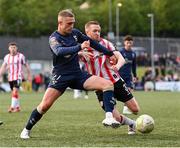 2 May 2025; Evan Caffrey of Shelbourne in action against Shane Ferguson of Derry City during the SSE Airtricity Men's Premier Division match between Derry City and Shelbourne at The Ryan McBride Brandywell Stadium in Derry. Photo by Stephen McCarthy/Sportsfile