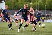 2 May 2025; Evan Caffrey of Shelbourne in action against Shane Ferguson of Derry City during the SSE Airtricity Men's Premier Division match between Derry City and Shelbourne at The Ryan McBride Brandywell Stadium in Derry. Photo by Stephen McCarthy/Sportsfile