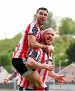 2 May 2025; Derry City's Liam Boyce is congratulated by team-mate Michael Duffy after scoring their side's second goal during the SSE Airtricity Men's Premier Division match between Derry City and Shelbourne at The Ryan McBride Brandywell Stadium in Derry. Photo by Stephen McCarthy/Sportsfile