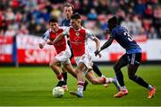 2 May 2025; Mason Melia of St Patrick's Athletic in action against Jeannot Esua of Galway United during the SSE Airtricity Men's Premier Division match between St Patrick's Athletic and Galway United at Richmond Park in Dublin. Photo by David Fitzgerald/Sportsfile