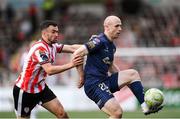 2 May 2025; Kerr McInroy of Shelbourne in action against Michael Duffy of Derry City during the SSE Airtricity Men's Premier Division match between Derry City and Shelbourne at The Ryan McBride Brandywell Stadium in Derry. Photo by Stephen McCarthy/Sportsfile