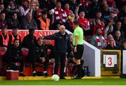 2 May 2025; Referee Damien McGrath shows a yellow card to Galway United manager John Caulfield during the SSE Airtricity Men's Premier Division match between St Patrick's Athletic and Galway United at Richmond Park in Dublin. Photo by David Fitzgerald/Sportsfile