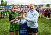 3 May 2025; Portdara captain Aoife Murphy is presented with the trophy by Leinster and Ireland international Aoife Wafer after the Leinster Rugby U14 Girls Cup final match between Mullingar Blue and Portdara at Energia Park in Dublin. Photo by Tyler Miller/Sportsfile