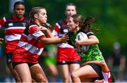 3 May 2025; Eabha Ryan of Portdara is tackled by Eva Fitzpatrick of Wicklow during the Leinster Rugby U16 Girls Plate final match between Portdara and Wicklow at Energia Park in Dublin. Photo by Tyler Miller/Sportsfile