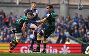 3 May 2025; Sam Prendergast of Leinster has a kick blocked by Fraser Dingwall, left, and Josh Kemeny of Northampton Saints during the Investec Champions Cup semi-final match between Leinster and Northampton Saints at the Aviva Stadium in Dublin. Photo by Brendan Moran/Sportsfile