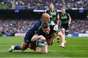 3 May 2025; Tommy Freeman of Northampton Saints dives over to score his side's first try despite the efforts of Jamison Gibson-Park of Leinster during the Investec Champions Cup semi-final match between Leinster and Northampton Saints at the Aviva Stadium in Dublin. Photo by David Fitzgerald/Sportsfile