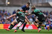 3 May 2025; Sam Prendergast of Leinster is tackled by Fraser Dingwall, left, and Henry Pollock of Northampton Saints during the Investec Champions Cup semi-final match between Leinster and Northampton Saints at the Aviva Stadium in Dublin. Photo by Brendan Moran/Sportsfile