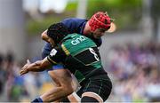 3 May 2025; Josh van der Flier of Leinster is tackled by Juarno Augustus of Northampton Saints during the Investec Champions Cup semi-final match between Leinster and Northampton Saints at the Aviva Stadium in Dublin. Photo by Brendan Moran/Sportsfile