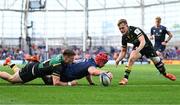 3 May 2025; Josh van der Flier of Leinster dives over to score his side's second try despite the efforts of Tommy Freeman of Northampton Saints during the Investec Champions Cup semi-final match between Leinster and Northampton Saints at the Aviva Stadium in Dublin. Photo by Brendan Moran/Sportsfile