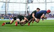 3 May 2025; Josh van der Flier of Leinster dives over to score his side's second try despite the efforts of Tommy Freeman, centre, and Tom Litchfield of Northampton Saints during the Investec Champions Cup semi-final match between Leinster and Northampton Saints at the Aviva Stadium in Dublin. Photo by Brendan Moran/Sportsfile