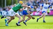 3 May 2025; Mark Fitzgerald of Waterford in action against Limerick players Tom Morrissey and William O'Donoghue, behind, during the Munster GAA Hurling Senior Championship Round 3 match between Waterford and Limerick at Walsh Park in Waterford. Photo by Piaras Ó Mídheach/Sportsfile