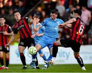 2 May 2025; Padraig Amond of Waterford in action against Keith Buckley, left, and Jordan Flores of Bohemians during the SSE Airtricity Men's Premier Division match between Bohemians and Waterford at Dalymount Park in Dublin. Photo by Michael P Ryan/Sportsfile