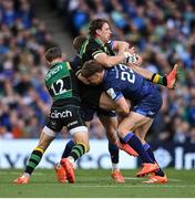 3 May 2025; James Ramm of Northampton Saints is tackled by Jordie Barrett, right, and Garry Ringrose of Leinster during the Investec Champions Cup semi-final match between Leinster and Northampton Saints at the Aviva Stadium in Dublin. Photo by David Fitzgerald/Sportsfile