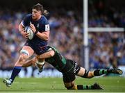 3 May 2025; Joe McCarthy of Leinster is tackled by Josh Kemeny of Northampton Saints during the Investec Champions Cup semi-final match between Leinster and Northampton Saints at the Aviva Stadium in Dublin. Photo by David Fitzgerald/Sportsfile