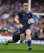 3 May 2025; Tommy O'Brien of Leinster is tackled by Juarno Augustus of Northampton Saints during the Investec Champions Cup semi-final match between Leinster and Northampton Saints at the Aviva Stadium in Dublin. Photo by Brendan Moran/Sportsfile