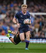 3 May 2025; Tommy O'Brien of Leinster is tackled by Juarno Augustus of Northampton Saints during the Investec Champions Cup semi-final match between Leinster and Northampton Saints at the Aviva Stadium in Dublin. Photo by Brendan Moran/Sportsfile