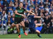 3 May 2025; Tommy O'Brien of Leinster is tackled by Juarno Augustus of Northampton Saints after the ball had been kicked during the Investec Champions Cup semi-final match between Leinster and Northampton Saints at the Aviva Stadium in Dublin. Photo by David Fitzgerald/Sportsfile
