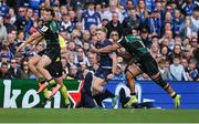 3 May 2025; Tommy O'Brien of Leinster is tackled by Juarno Augustus of Northampton Saints after the ball had been kicked during the Investec Champions Cup semi-final match between Leinster and Northampton Saints at the Aviva Stadium in Dublin. Photo by Brendan Moran/Sportsfile