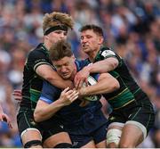 3 May 2025; Jordie Barrett of Leinster is tackled by Henry Pollock, left, and Fraser Dingwall of Northampton Saints during the Investec Champions Cup semi-final match between Leinster and Northampton Saints at the Aviva Stadium in Dublin. Photo by Brendan Moran/Sportsfile