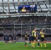 3 May 2025; Leinster players look on as referee Pierre Brousset watches the big screen on a last minute play during the Investec Champions Cup semi-final match between Leinster and Northampton Saints at the Aviva Stadium in Dublin. Photo by Brendan Moran/Sportsfile