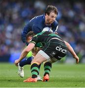 3 May 2025; Ryan Baird of Leinster is tackled by Angus Scott-Young of Northampton Saints during the Investec Champions Cup semi-final match between Leinster and Northampton Saints at the Aviva Stadium in Dublin. Photo by David Fitzgerald/Sportsfile