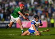 3 May 2025; Mark Fitzgerald of Waterford is tackled by Barry Nash of Limerick during the Munster GAA Hurling Senior Championship Round 3 match between Waterford and Limerick at Walsh Park in Waterford. Photo by Tom Beary/Sportsfile