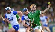 3 May 2025; Adam English of Limerick in action against Conor Prunty of Waterford during the Munster GAA Hurling Senior Championship Round 3 match between Waterford and Limerick at Walsh Park in Waterford. Photo by Piaras Ó Mídheach/Sportsfile