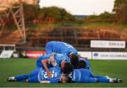 2 May 2025; James Olayinka of Waterford, hidden, is congratulated by team-mates after scoring his sides first goal during the SSE Airtricity Men's Premier Division match between Bohemians and Waterford at Dalymount Park in Dublin. Photo by Michael P Ryan/Sportsfile