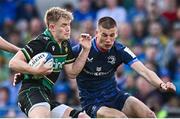 3 May 2025; Fin Smith of Northampton Saints is tackled by Sam Prendergast of Leinster during the Investec Champions Cup semi-final match between Leinster and Northampton Saints at the Aviva Stadium in Dublin. Photo by Seb Daly/Sportsfile