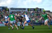 3 May 2025; Jack Prendergast of Waterford scores a point despite the attention of William O'Donoghue of Limerick during the Munster GAA Hurling Senior Championship Round 3 match between Waterford and Limerick at Walsh Park in Waterford. Photo by Tom Beary/Sportsfile