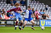 4 May 2025; Ty Corcoran of College Corinthians in action against Mark Leahy of Mervue United during the FAI Youth Cup final match between Mervue United and College Corinthians at Eamonn Deacy Park in Galway. Photo by Tyler Miller/Sportsfile