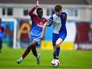 4 May 2025; Kai O'Neill of College Corinthians in action against Fergal Takaza of Mervue United during the FAI Youth Cup final match between Mervue United and College Corinthians at Eamonn Deacy Park in Galway. Photo by Tyler Miller/Sportsfile