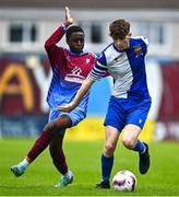 4 May 2025; Kai O'Neill of College Corinthians in action against Fergal Takaza of Mervue United during the FAI Youth Cup final match between Mervue United and College Corinthians at Eamonn Deacy Park in Galway. Photo by Tyler Miller/Sportsfile