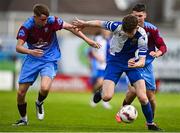 4 May 2025; Kai O'Neill of College Corinthians in action against Lee Traynor-Curley of Mervue United during the FAI Youth Cup final match between Mervue United and College Corinthians at Eamonn Deacy Park in Galway. Photo by Tyler Miller/Sportsfile