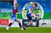 4 May 2025; Padraig McGrath of College Corinthians in action against Joey Cunningham of Mervue United during the FAI Youth Cup final match between Mervue United and College Corinthians at Eamonn Deacy Park in Galway. Photo by Tyler Miller/Sportsfile