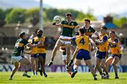 4 May 2025; Barry Dan O'Sullivan and Ruairí Murphy of Kerry contest a loose ball with Ronan Lanigan of Clare during the Munster GAA Football Senior Championship final match between Kerry and Clare at Fitzgerald Stadium in Killarney, Kerry. Photo by Brendan Moran/Sportsfile