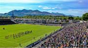 4 May 2025; The Kerry and Clare players march behind the Millstreet Pipe Band in the parade before the Munster GAA Football Senior Championship final match between Kerry and Clare at Fitzgerald Stadium in Killarney, Kerry. Photo by Piaras Ó Mídheach/Sportsfile