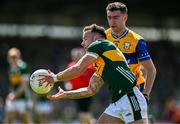 4 May 2025; Micheál Burns of Kerry in action against Manus Doherty of Clare during the Munster GAA Football Senior Championship final match between Kerry and Clare at Fitzgerald Stadium in Killarney, Kerry. Photo by Brendan Moran/Sportsfile