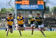 4 May 2025; Tony Brosnan of Kerry in action against Cillian Rouine of Clare during the Munster GAA Football Senior Championship final match between Kerry and Clare at Fitzgerald Stadium in Killarney, Kerry. Photo by Brendan Moran/Sportsfile