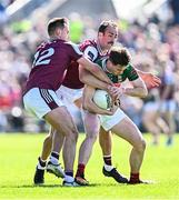 4 May 2025; Sam Callinan of Mayo is tackled by Galway players Cillian McDaid, left, and John Maher during the Connacht GAA Football Senior Championship final match between Mayo and Galway at Hastings Insurance MacHale Park in Castlebar, Mayo. Photo by Seb Daly/Sportsfile