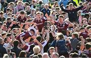 4 May 2025; Galway players, including Jack Glynn and Johnny McGrath, celebrate with supporters after their side's victory in the Connacht GAA Football Senior Championship final match between Mayo and Galway at Hastings Insurance MacHale Park in Castlebar, Mayo. Photo by Seb Daly/Sportsfile