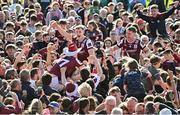 4 May 2025; Galway players, including Jack Glynn and Johnny McGrath, celebrate with supporters after their side's victory in the Connacht GAA Football Senior Championship final match between Mayo and Galway at Hastings Insurance MacHale Park in Castlebar, Mayo. Photo by Seb Daly/Sportsfile