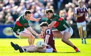 4 May 2025; Cathal Sweeney of Galway is tackled by Mayo players Stephen Coen, left, and Aidan O’Shea during the Connacht GAA Football Senior Championship final match between Mayo and Galway at Hastings Insurance MacHale Park in Castlebar, Mayo. Photo by Seb Daly/Sportsfile