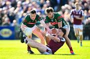 4 May 2025; Cathal Sweeney of Galway is tackled by Mayo players Stephen Coen, left, and Aidan O’Shea during the Connacht GAA Football Senior Championship final match between Mayo and Galway at Hastings Insurance MacHale Park in Castlebar, Mayo. Photo by Seb Daly/Sportsfile